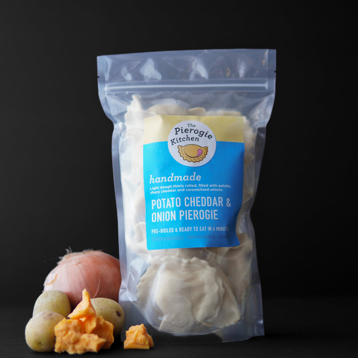 Frozen potato cheddar & onion pierogies in resealable plastic pouch, brand The Pierogi Kitchen